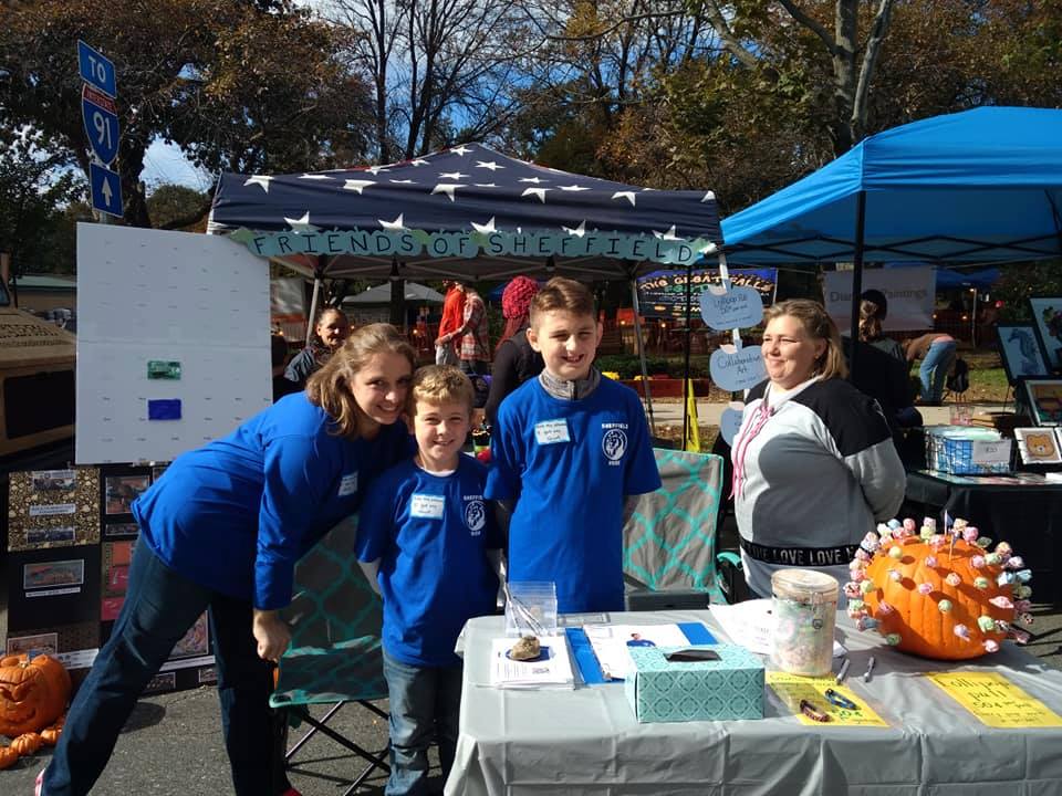 students and a parent wearing Sheffield Pride gear at the Great Falls Festival 